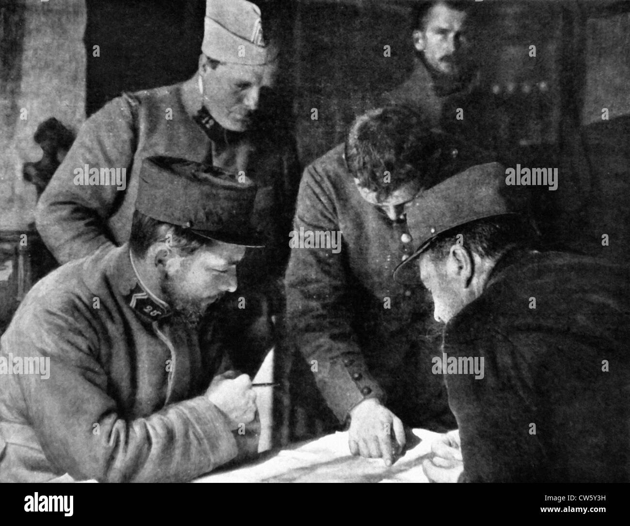 World War I. German prisoners pointing out their artillery positions on a map Stock Photo
