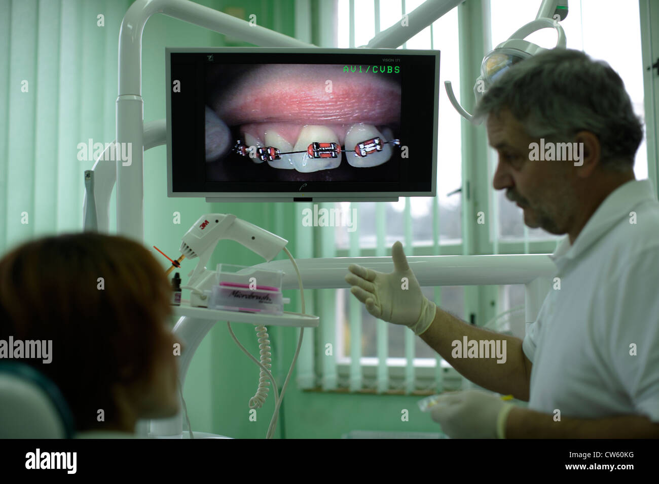 explains the patient's dentist office dental braces Stock Photo Alamy