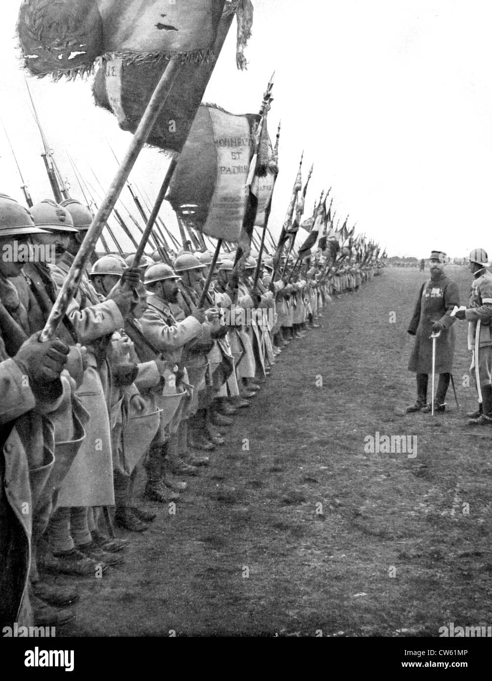 General Gouraud has gathered flags of all regiments of his army to salute a division who won battles in Verdun (1916) Stock Photo