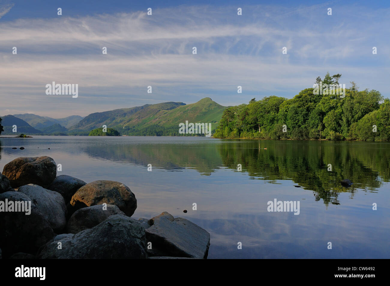 Cat Bells and Derwent Isle reflected in Derwent Water on a tranquil summer morning in the English lake District Stock Photo