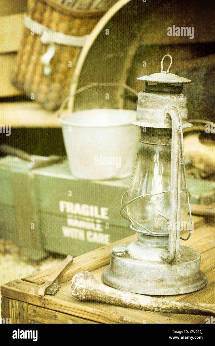 A vintage glass oil lamp on an old wooden crate Stock Photo Alamy