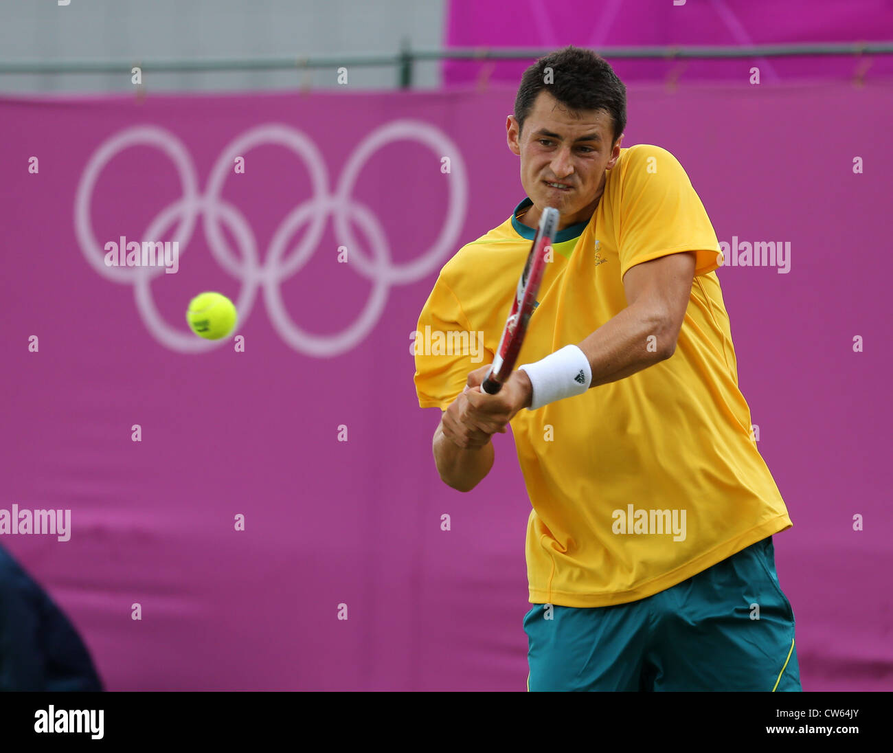 Bernard Tomic (AUS) in action at Wimbledon during the Olympic Games 2012 Stock Photo