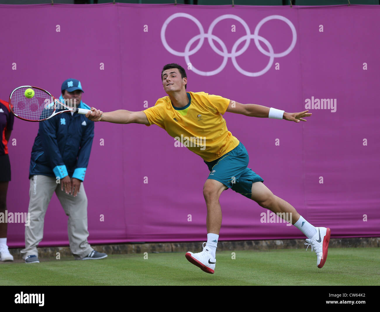 Bernard Tomic (AUS) in action at Wimbledon during the Olympic Games 2012 Stock Photo
