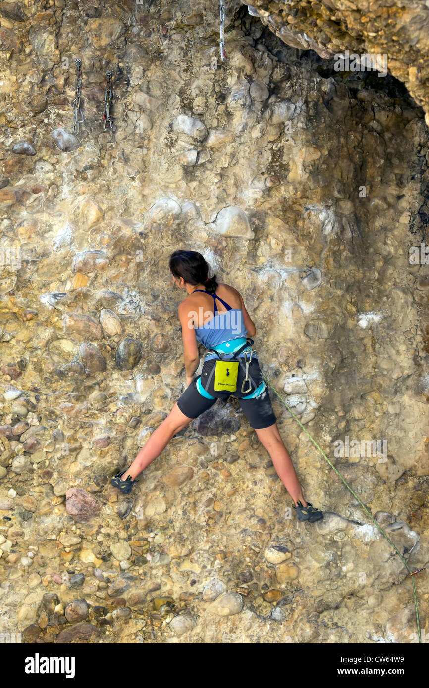 Woman climbing the face of a rock cliff. Maple Canyon, Utah Stock Photo ...