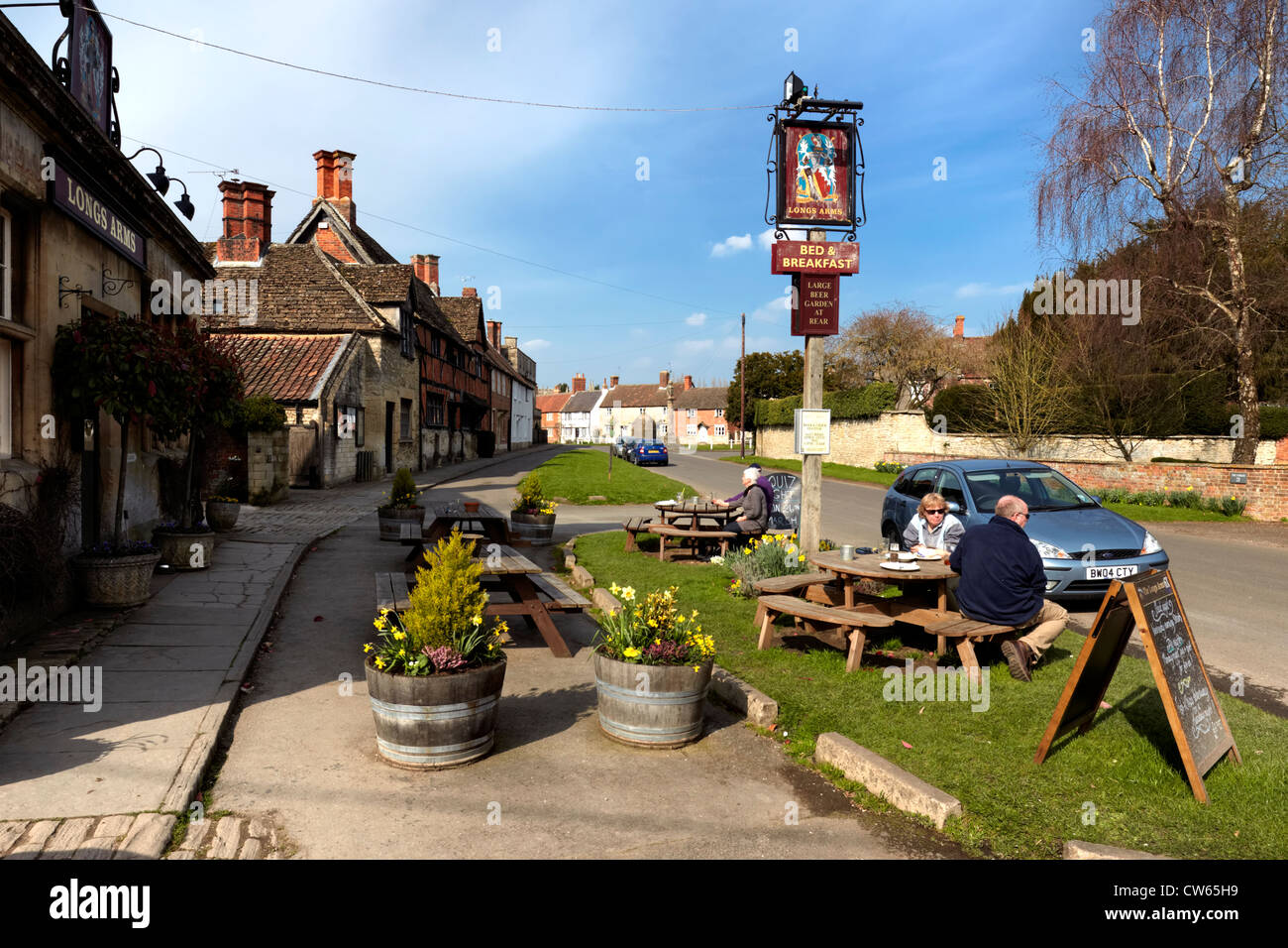 The Longs Arms Pub, is a 17th Century former Coach House set in the picturesque village of Steeple Ashton in Wiltshire, UK Stock Photo