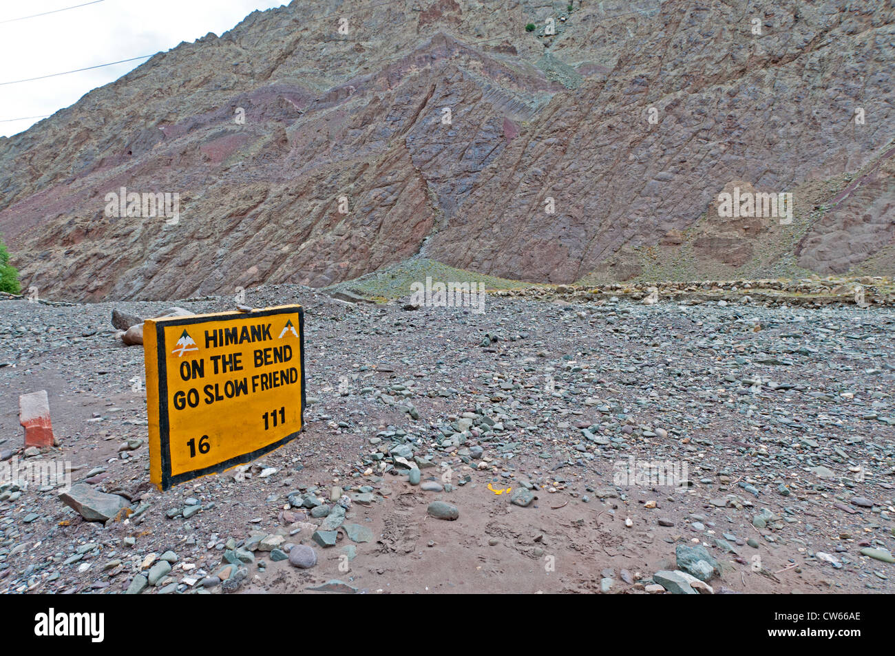 Sign by the side of the road in the mountains of Ladakh, India used as a warning to drivers Stock Photo