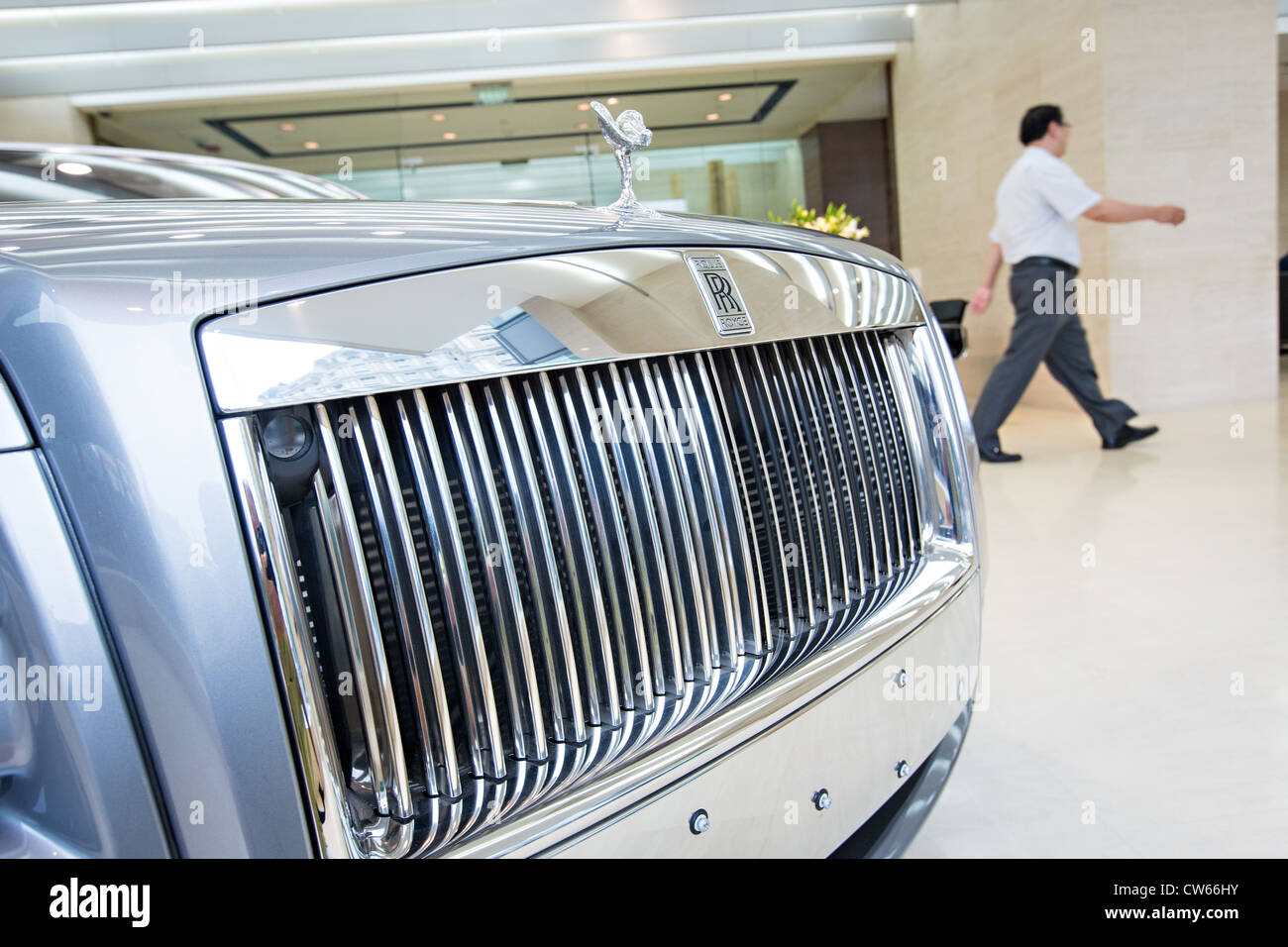 A Chinese millionaire shops for a Rolls Royce luxury car in Beijing