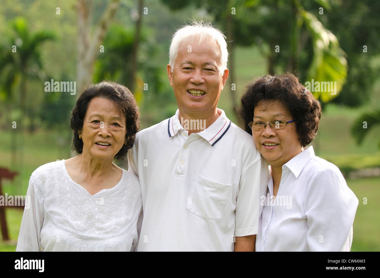 Senior Couple Relaxing In Garden Stock Photo - Alamy