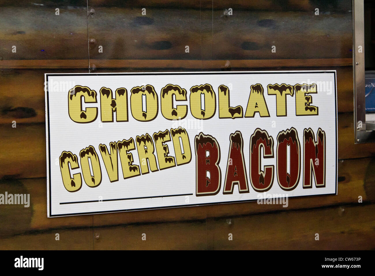 sign of food vendor selling chocolate covered bacon at Houston Rodeo Stock Photo