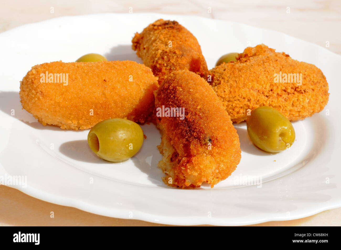 Ham and potato croquettes tapas with green olives, Andalusia, Spain, Western Europe. Stock Photo