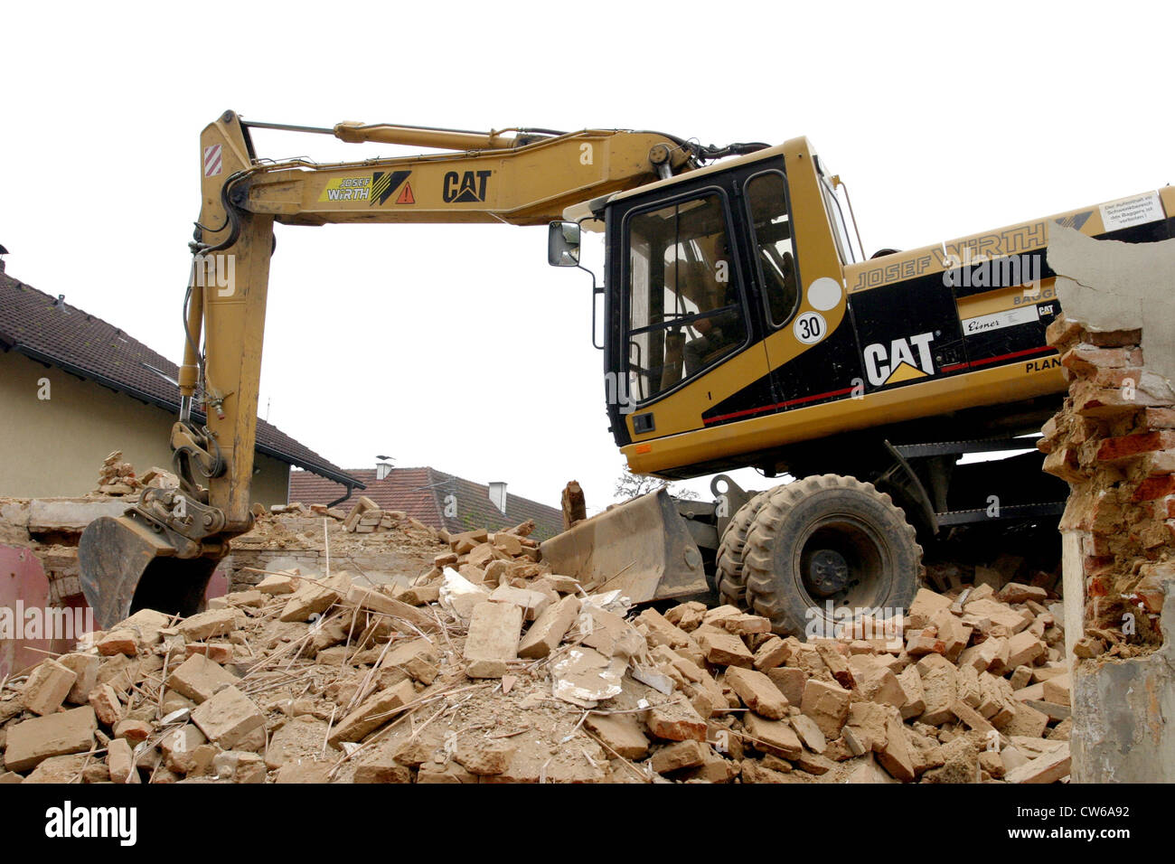 Excavator breaking off a building Stock Photo Alamy