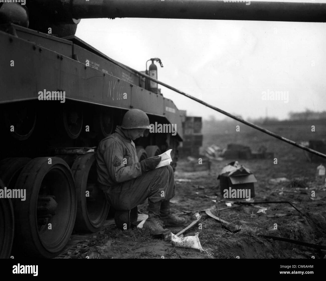 A U.S Army corporal reads the manual describing the General Pershing tank (Germany) March 29, 1945 Stock Photo
