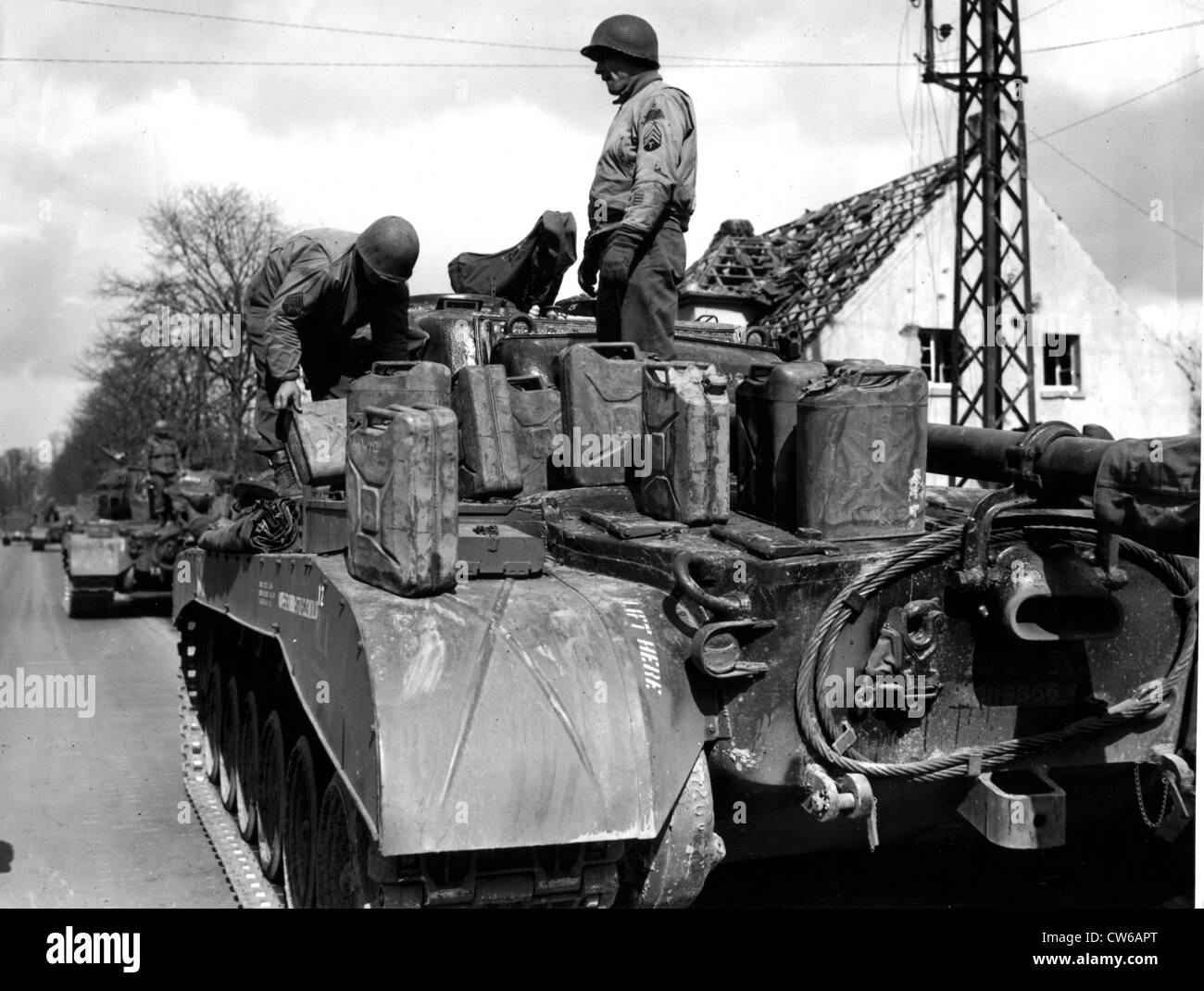 U.S General Pershing tank is refueled before crossing the Rhine river (Germany) March 30,1945 Stock Photo