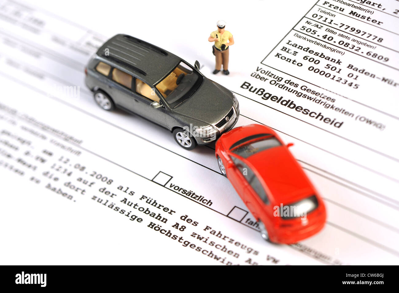 symbolic picture: acquisition of accident data, little police man figure and model cars on a fine document Stock Photo