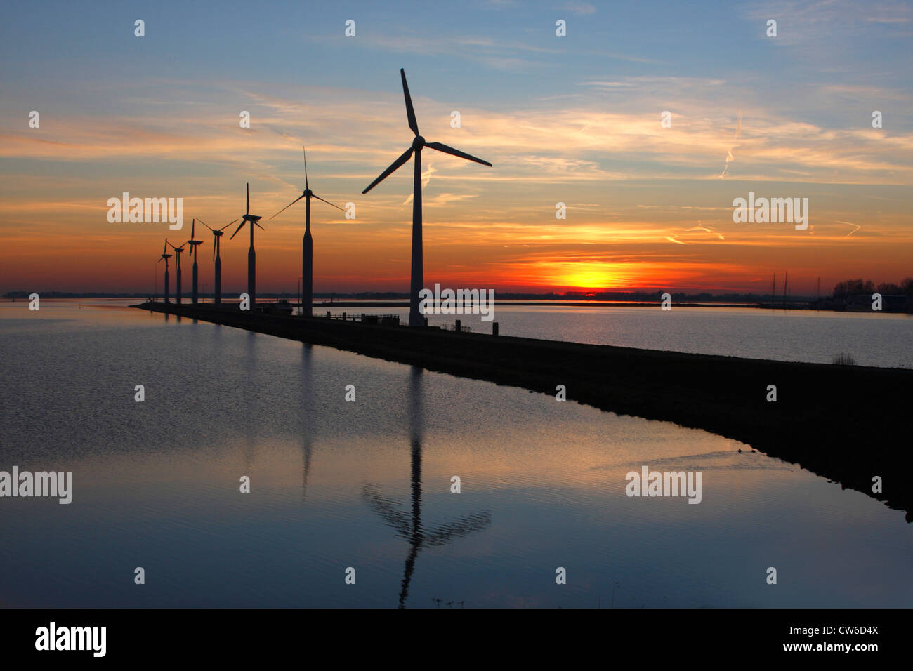 wind wheels at the Ijsselmeer in evening light, Netherlands, Enkhuizen Stock Photo