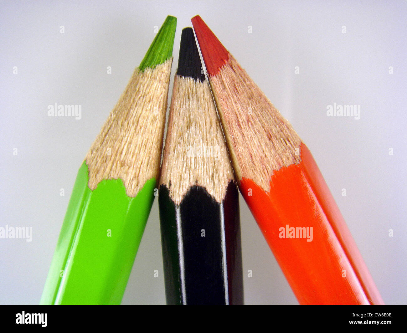 coloured crayons, in black, red and green Stock Photo Alamy