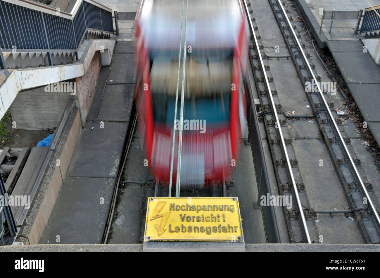 high voltage warning sign and tram line, Germany, North Rhine-Westphalia, Koeln Stock Photo