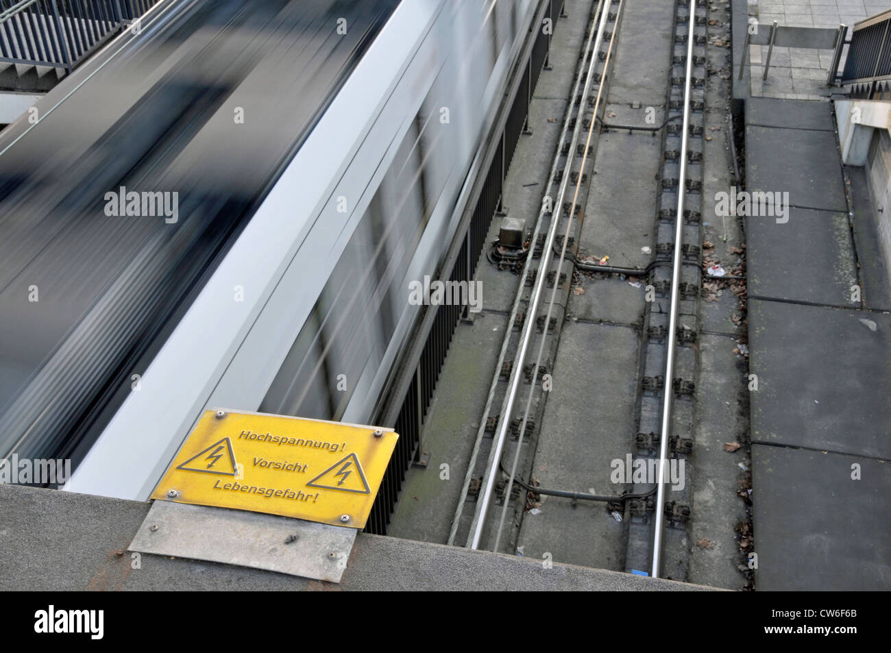 high voltage warning sign and tram line, Germany, North Rhine-Westphalia, Koeln Stock Photo