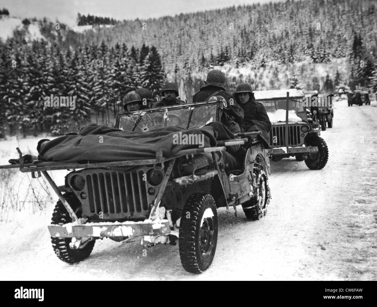 American medical men evacuate wounded in jeep in Belgium, January 1945 Stock Photo