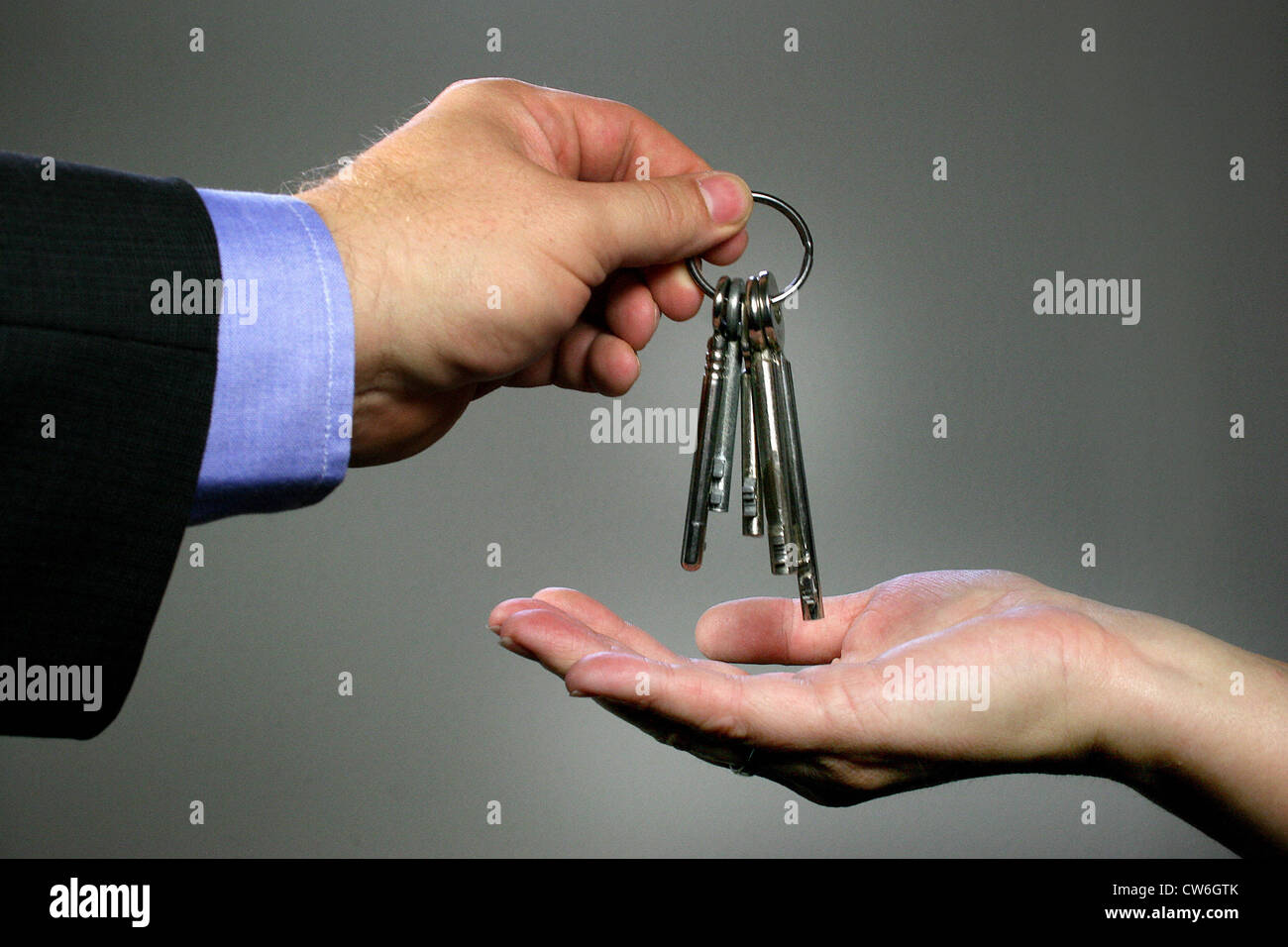 Two hands deliver keys Stock Photo Alamy