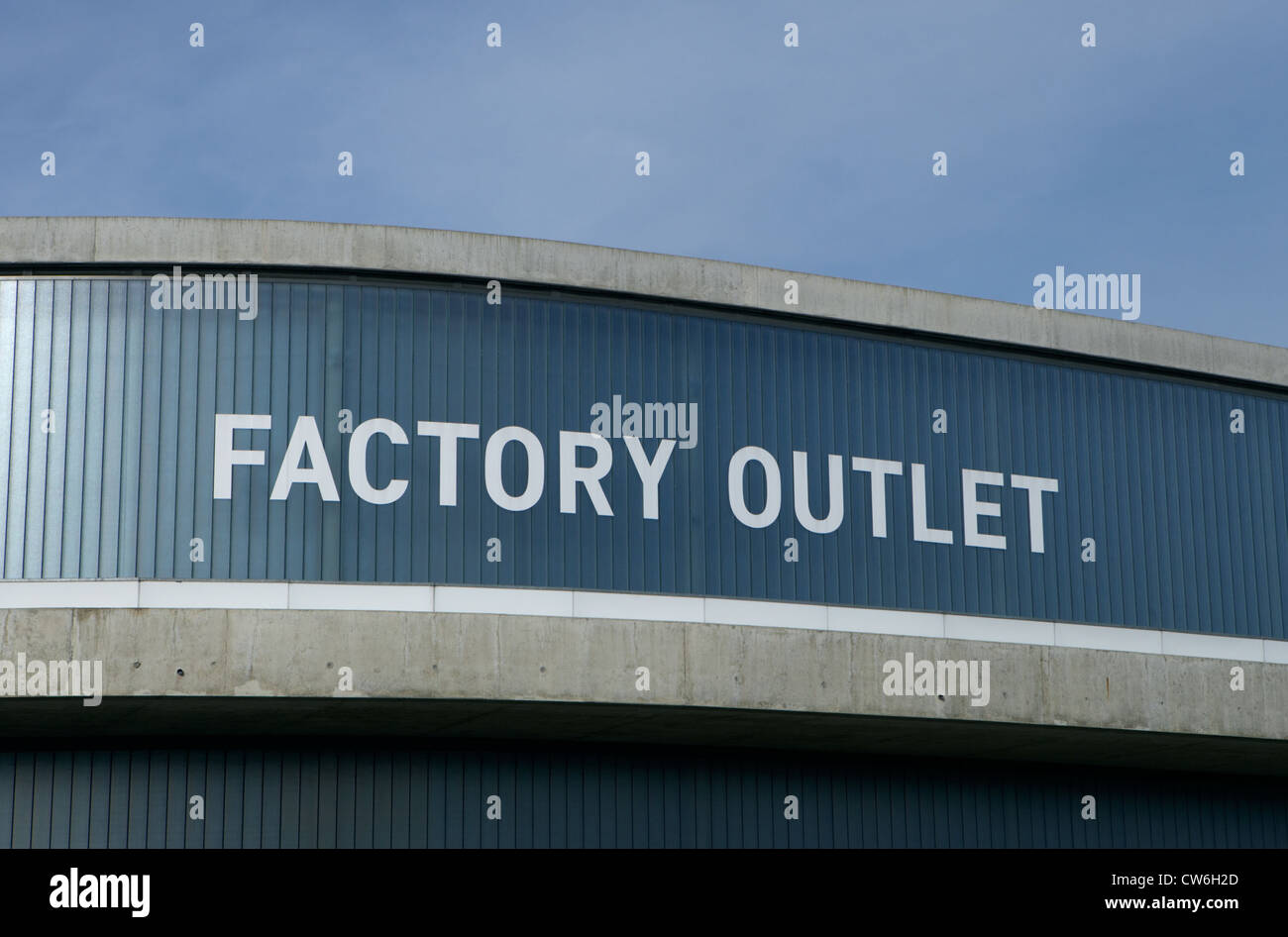 Lettering Factory Outlet on a facade Stock Photo