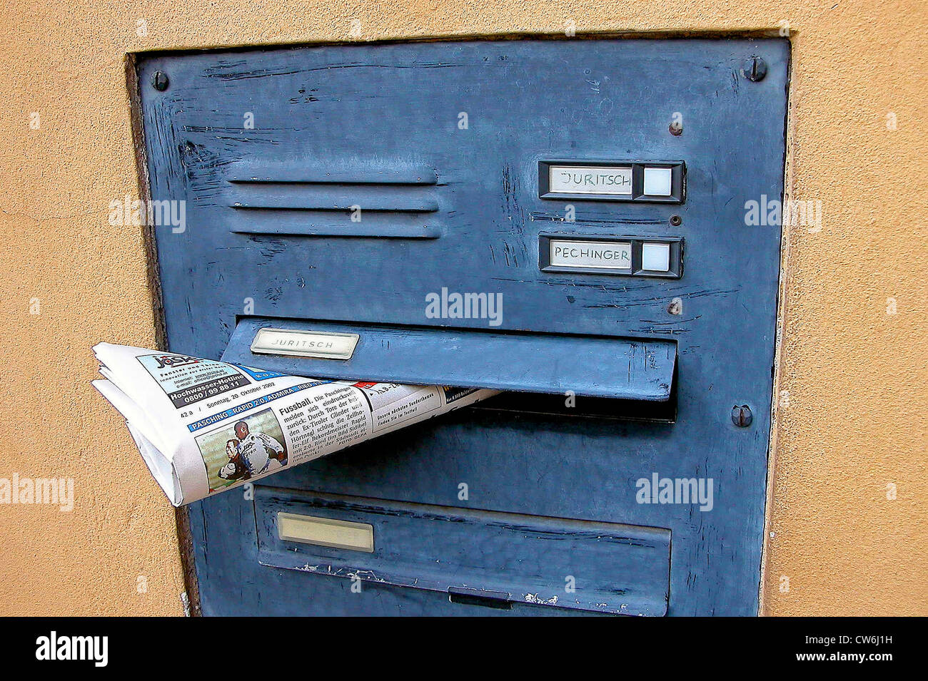 newspaper in a private letter box Stock Photo Alamy
