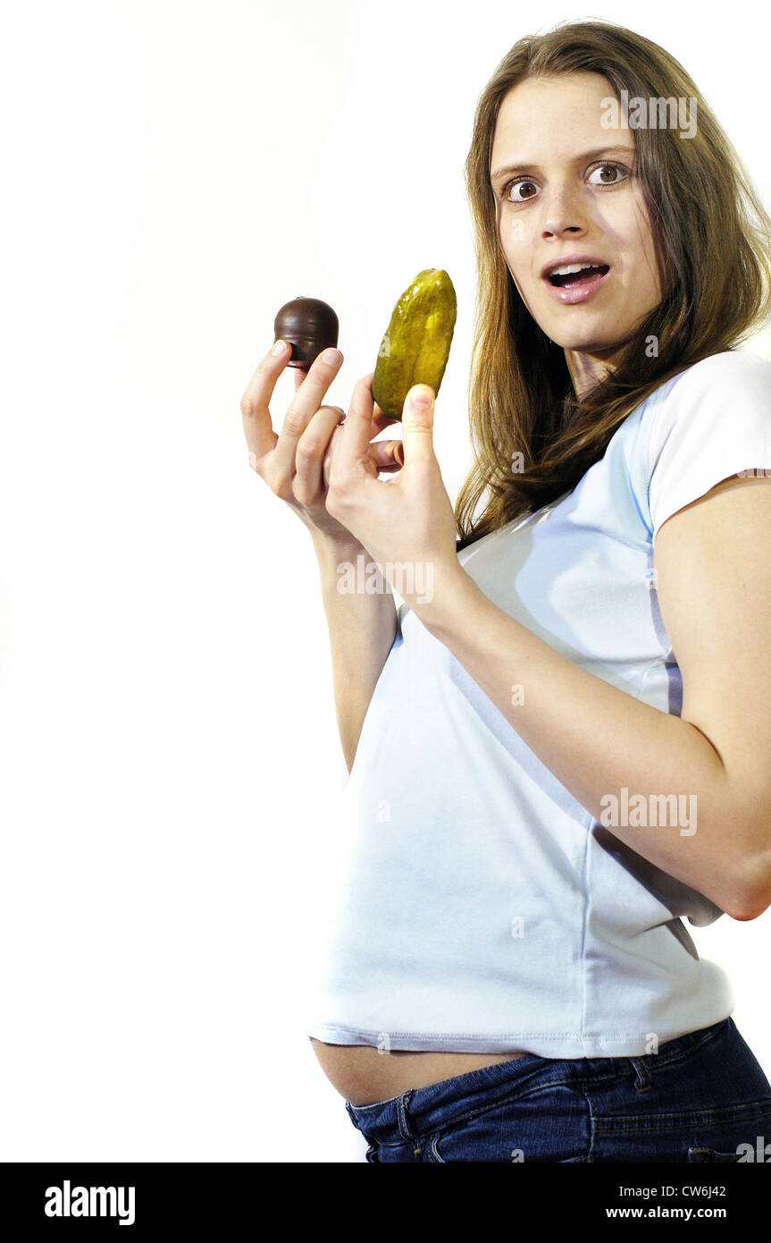pregnant woman with gherkin and chocolate marsmallow Stock Photo Alamy