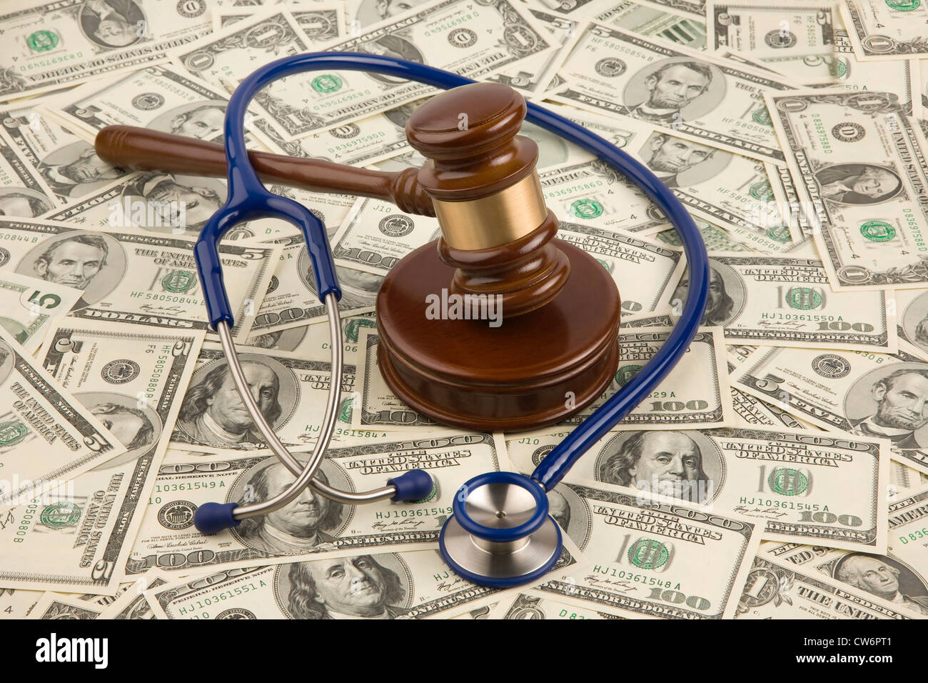 symbolic picture for justice and medicine, Dollar banknotes, stethoskop and court hammer, USA Stock Photo