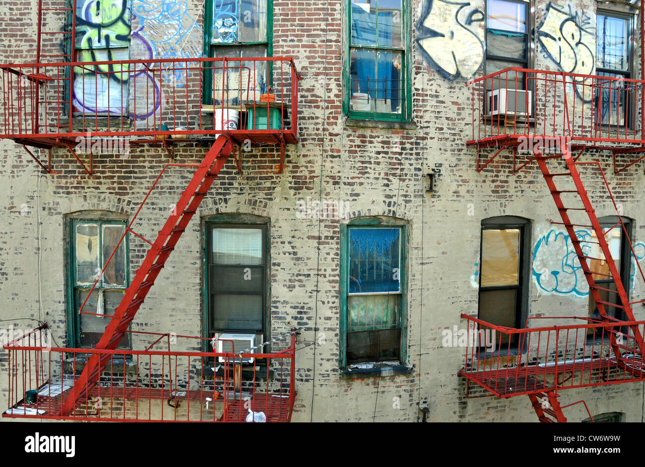 view on facade with fire escapes and graffitis, USA, Manhattan, New York City Stock Photo