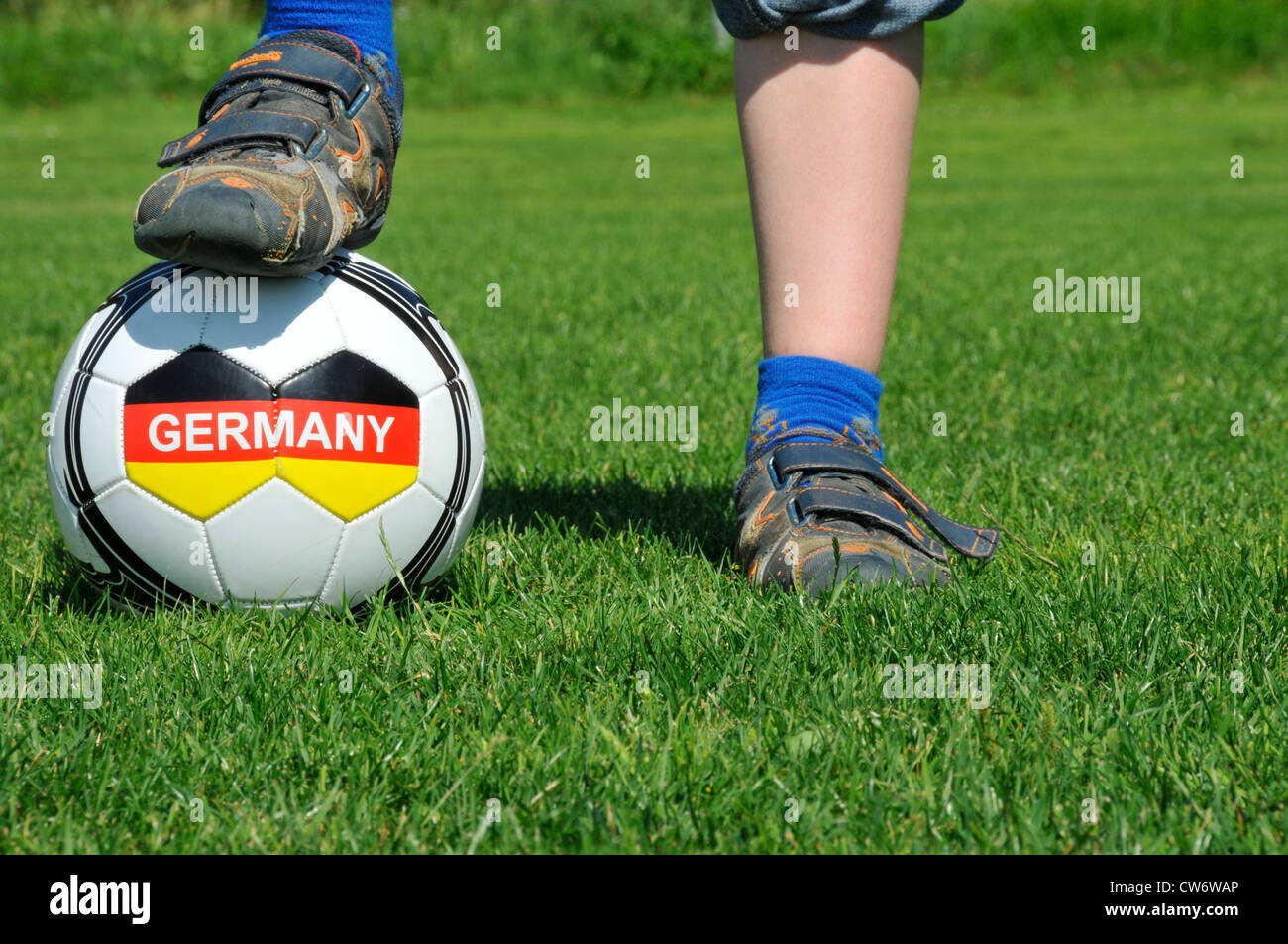 a boy's foot on a football with the writing 'Germany', Germany, Baden-Wuerttemberg Stock Photo