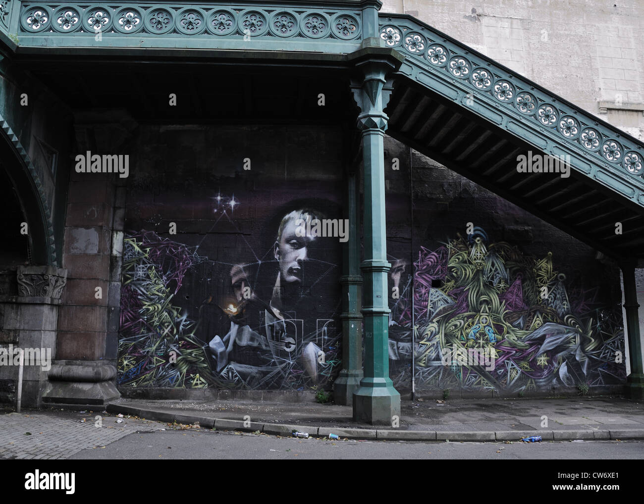 Graffiti under cast iron stairway in Kelvinbridge, Glasgow, Scotland, UK Stock Photo