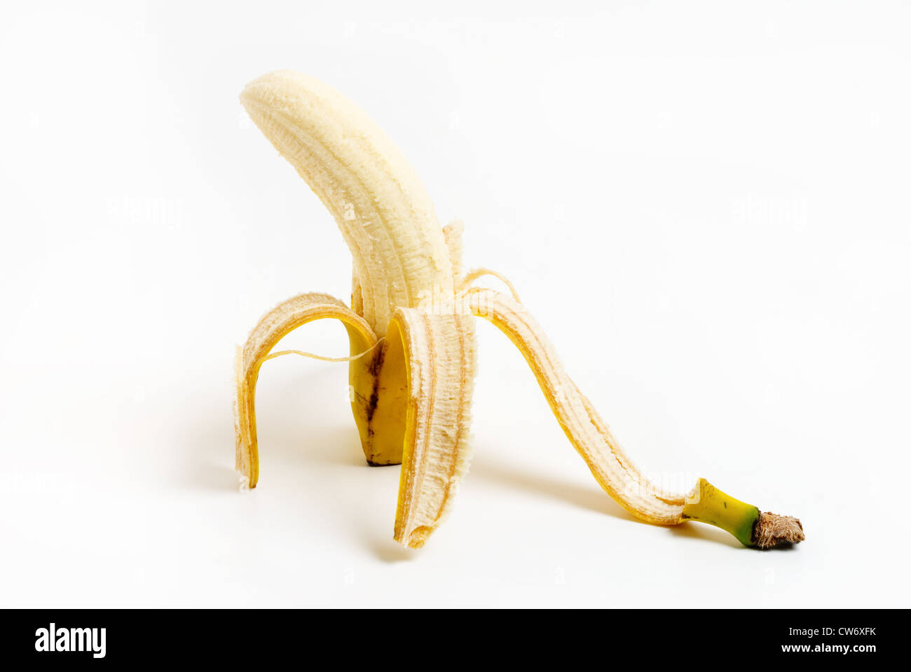 Peeled ripe banana fruit on white background Stock Photo