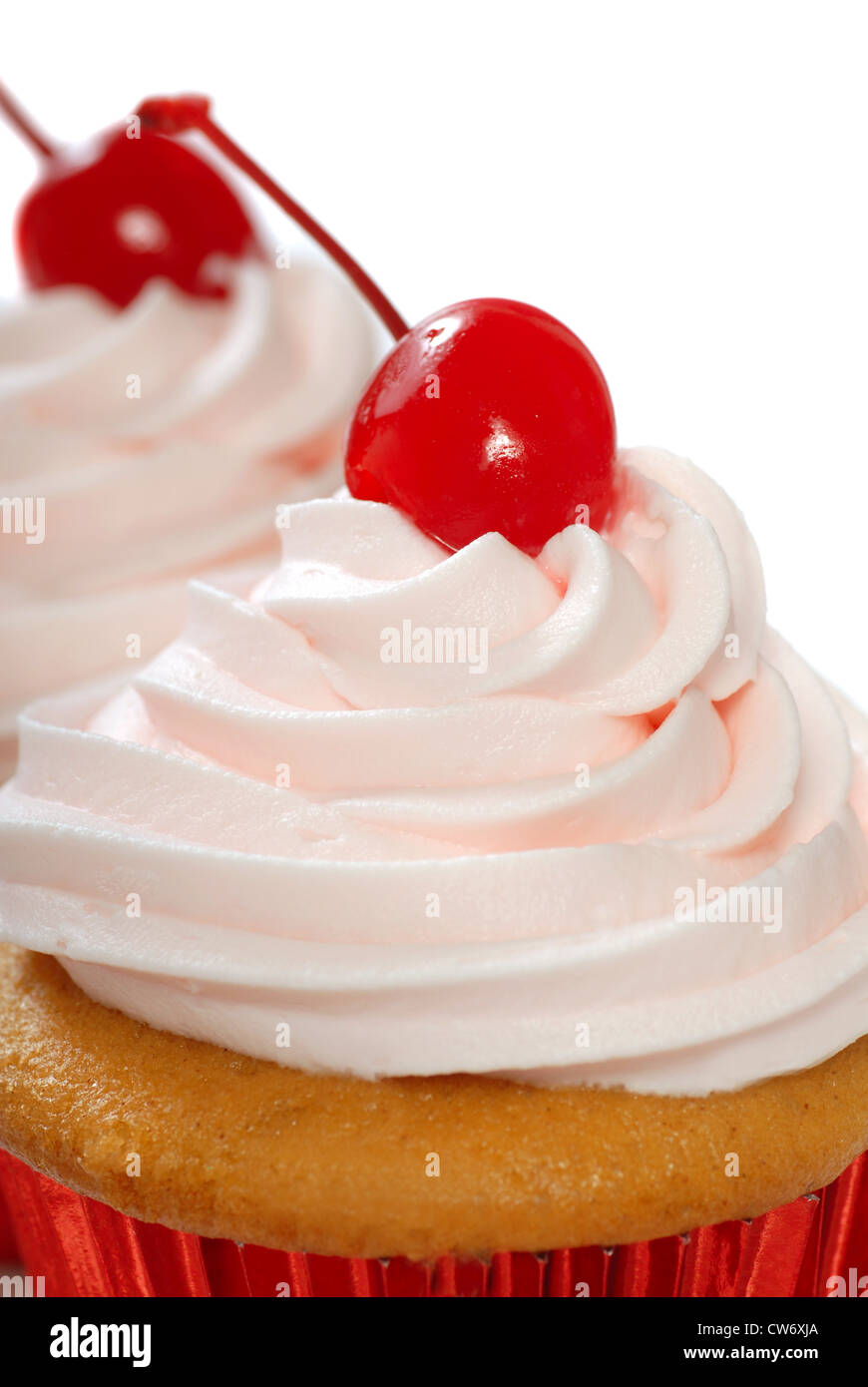 Delicious homemade vanilla cupcake with maraschino frosting and cherry Stock Photo