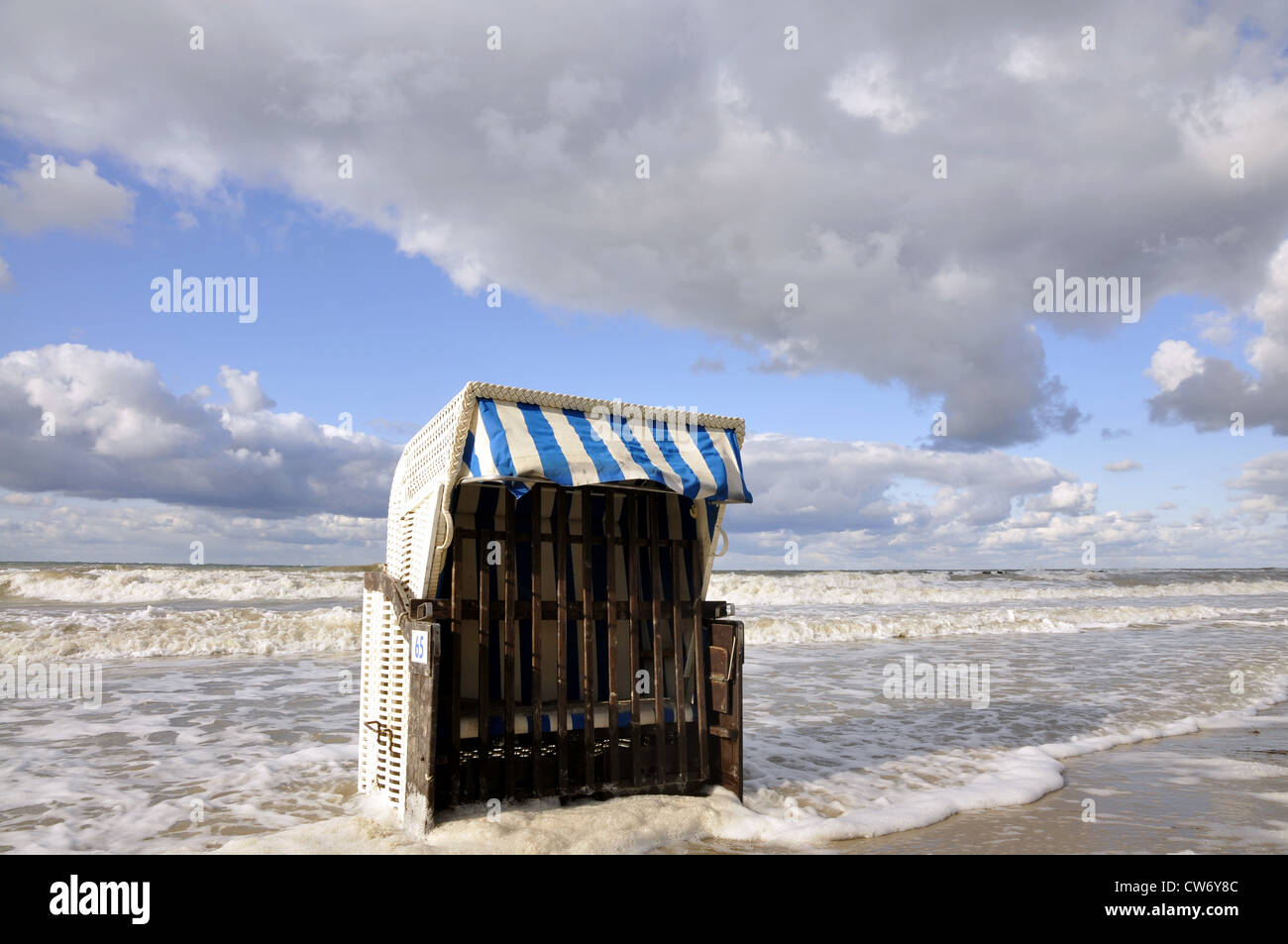 beach chair standing in the surf, Germany, Mecklenburg Vorpommern, Ostsee Stock Photo