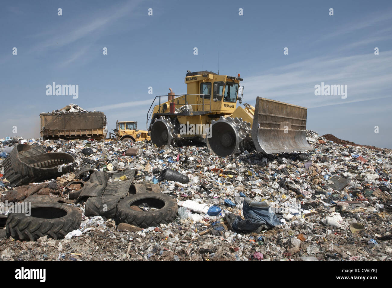 bulldozer and truck full of garbage on a waste disposal, United Kingdom, Scotland, Edinburgh Stock Photo