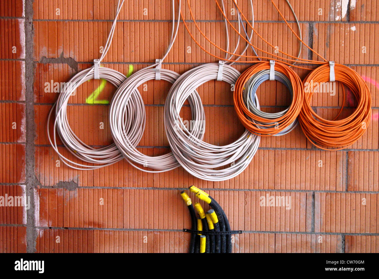 Cables On Bare Brickwork To Be Installed Stock Photo Alamy Cables On Bare Brickwork To Be Installed Stock Photo Alamy