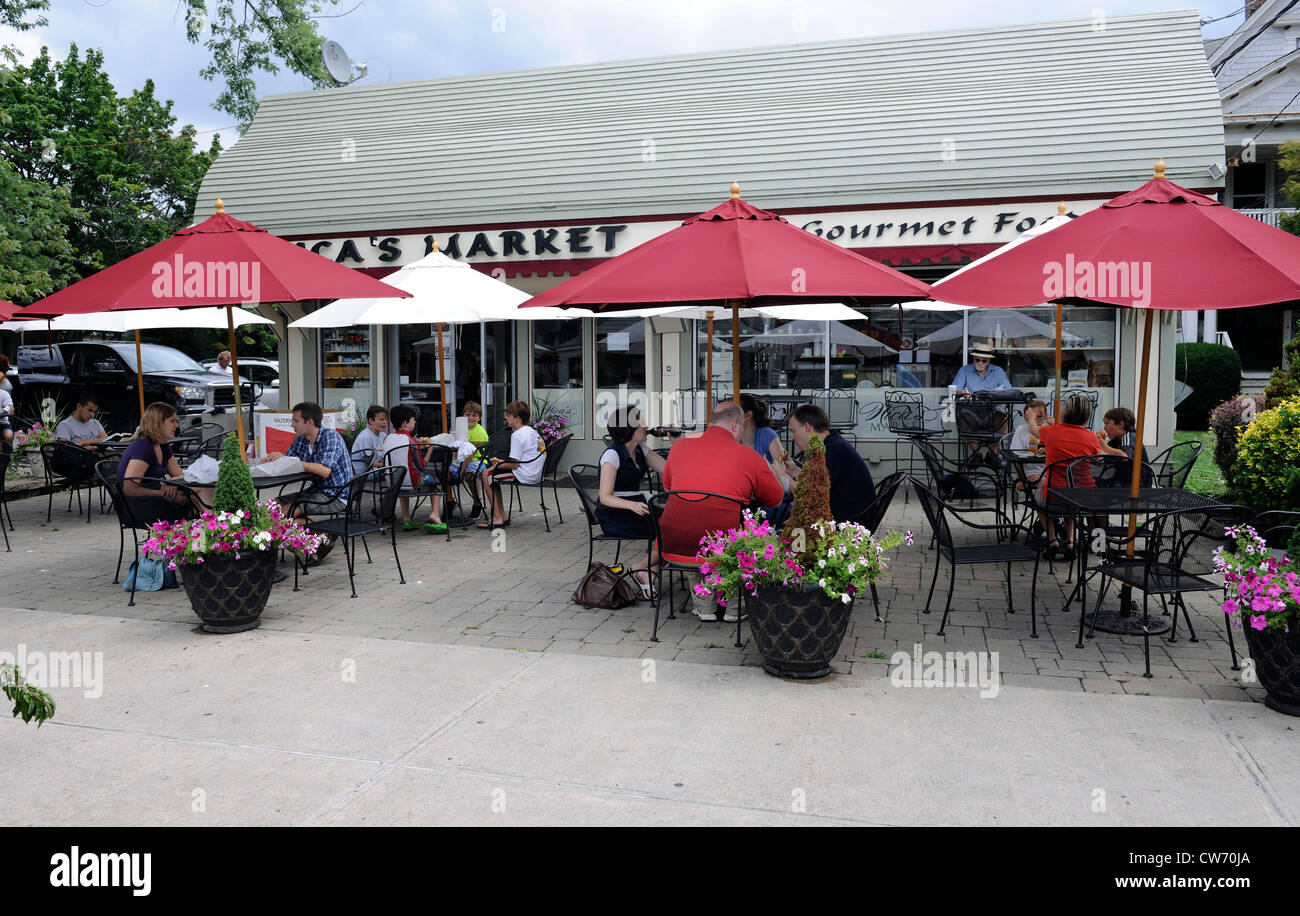 Outdoor tables at Nica's, an Italian grocery store and deli. Stock Photo