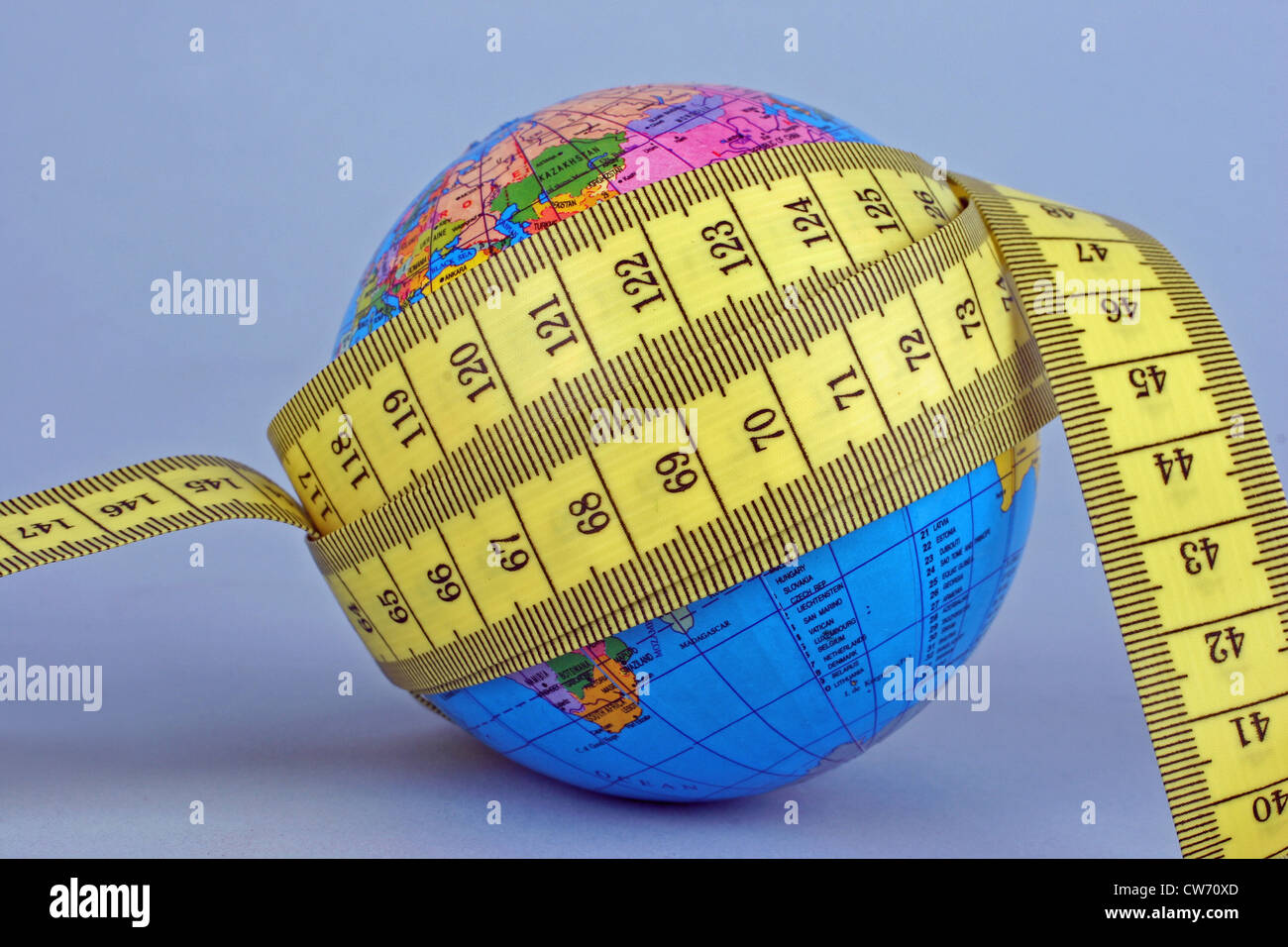 a globe and a tape measure Stock Photo Alamy