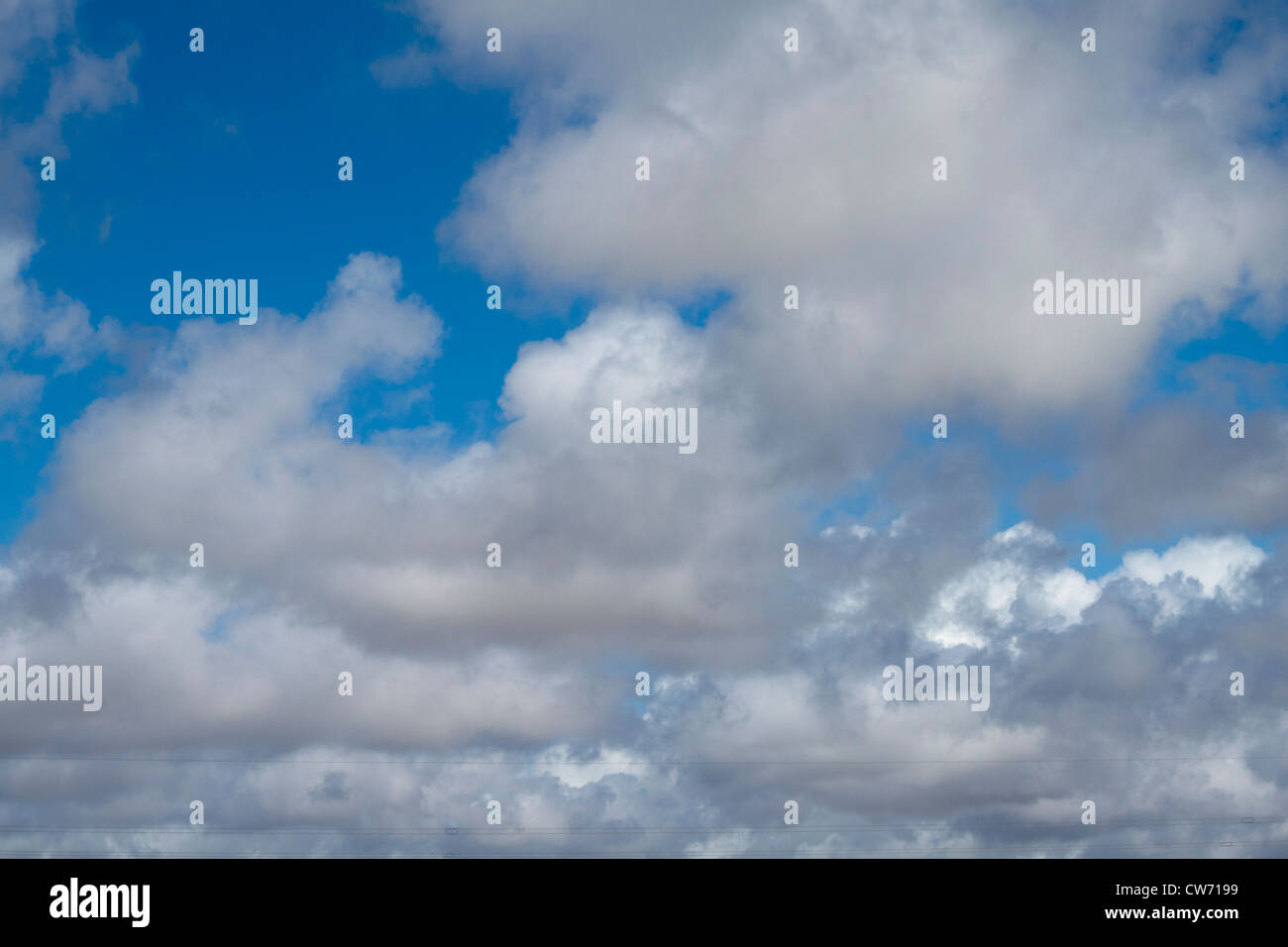 Blue sky with white and gray soft clouds Stock Photo - Alamy