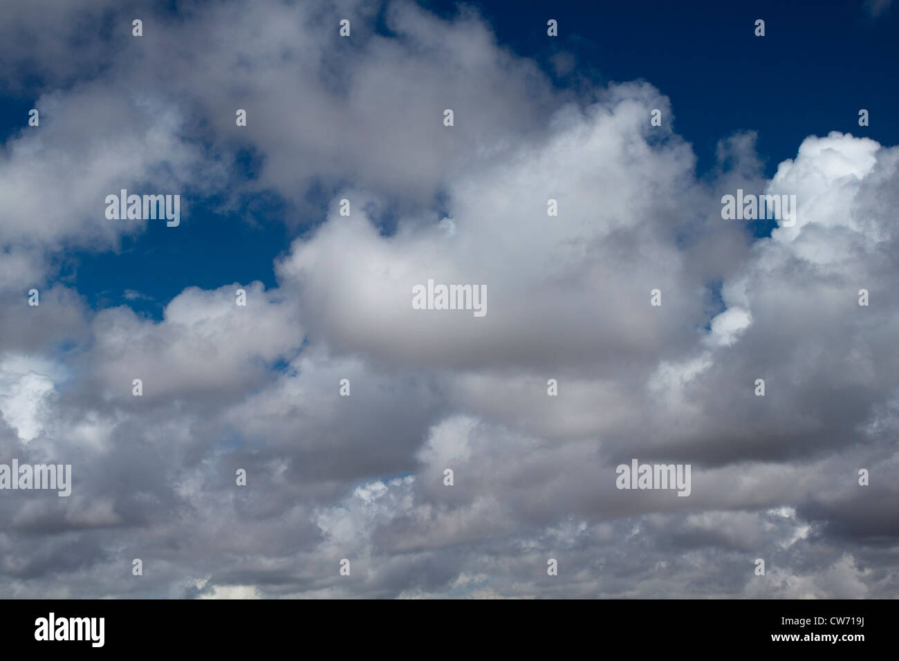 Blue sky with white and gray soft clouds Stock Photo - Alamy