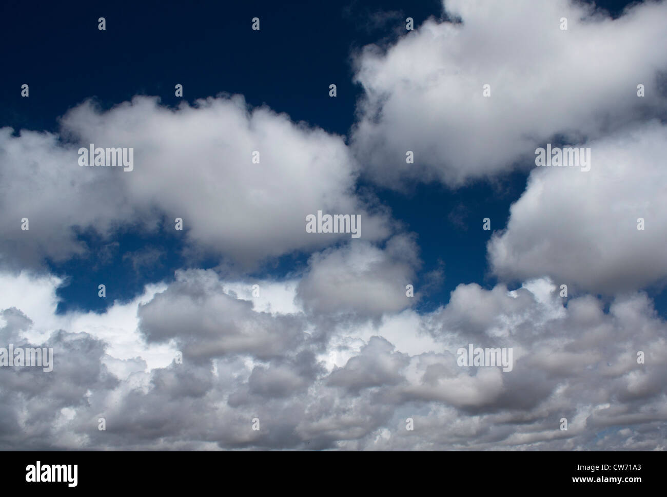 Blue sky with white and gray soft clouds Stock Photo - Alamy