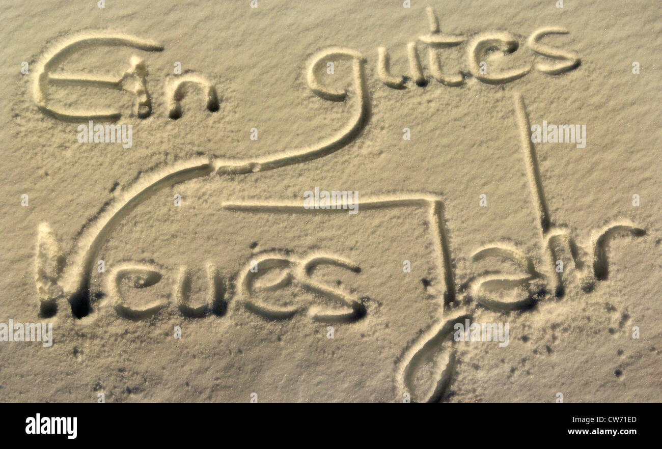 'Ein gutes neues Jahr', happy new year, written in the sand Stock Photo