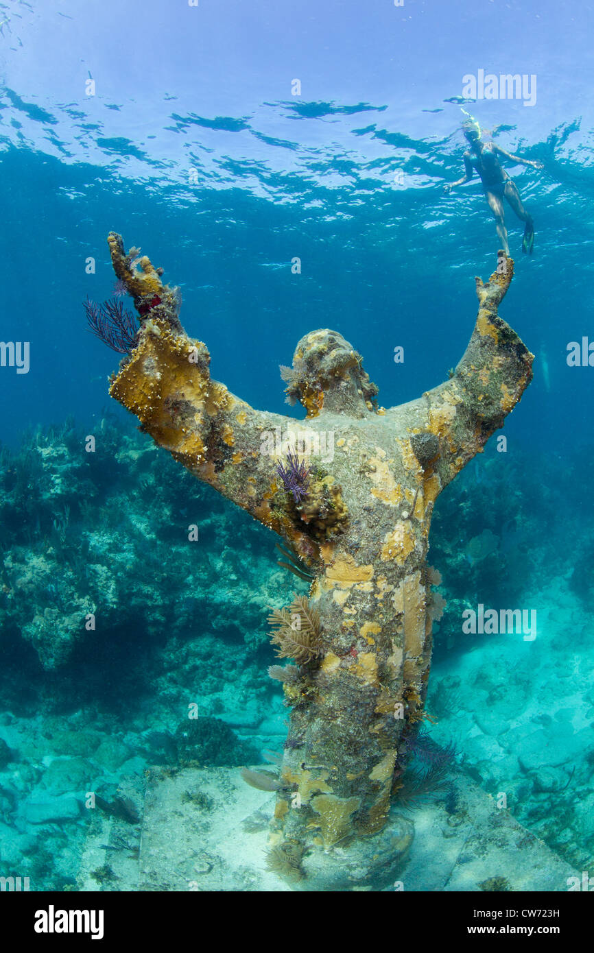Snorkeler with Statue of Christ of the Abyss Stock Photo