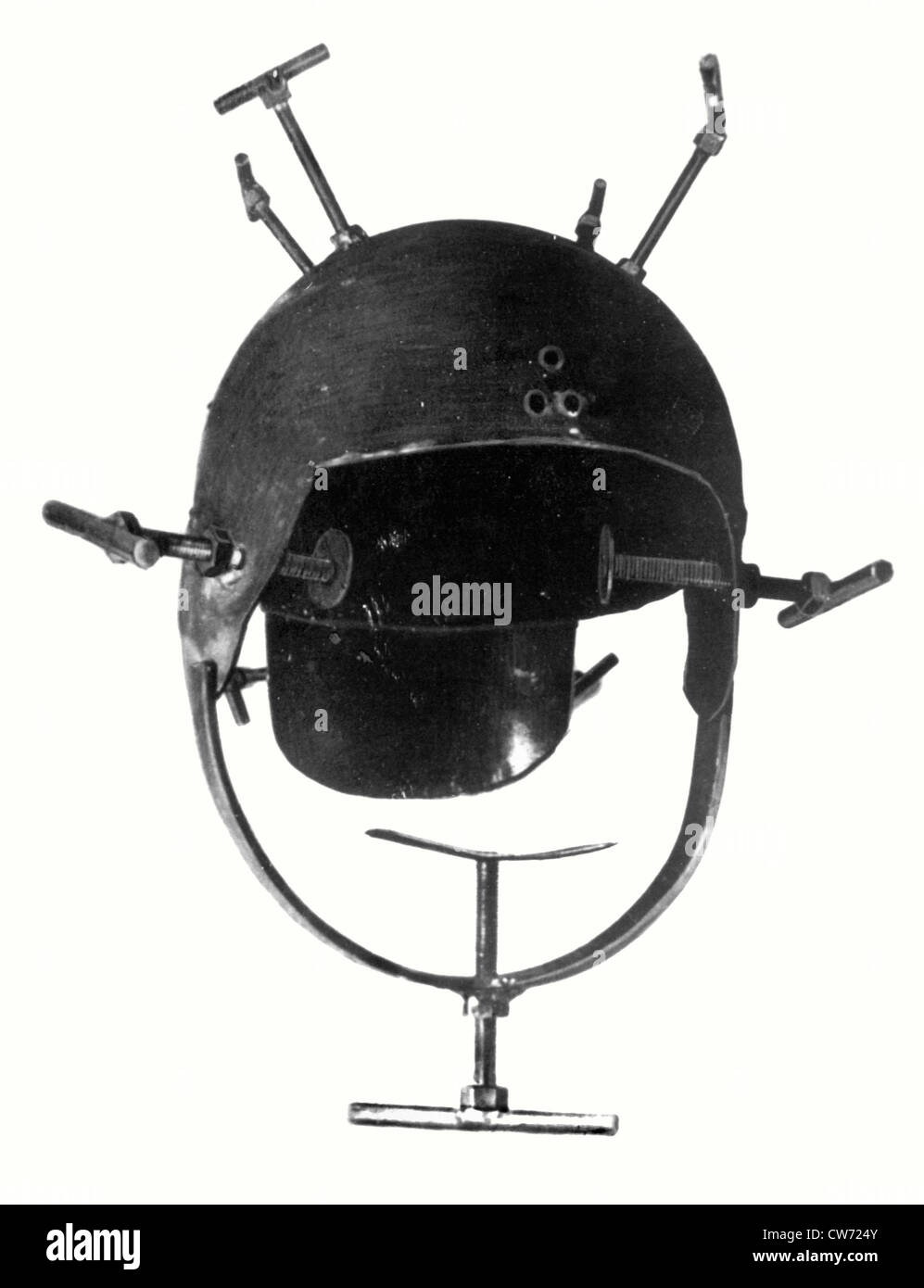 Helmet with screws used for torturing resistance fighters Stock Photo
