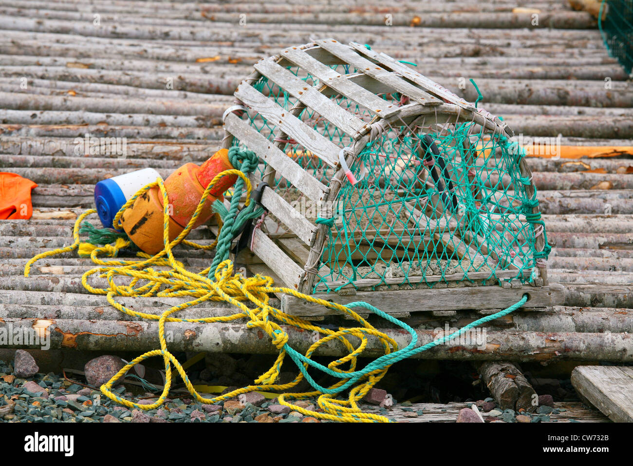 A wooden lobster trap with buoys and rope on Newfoundland, Canada Stock