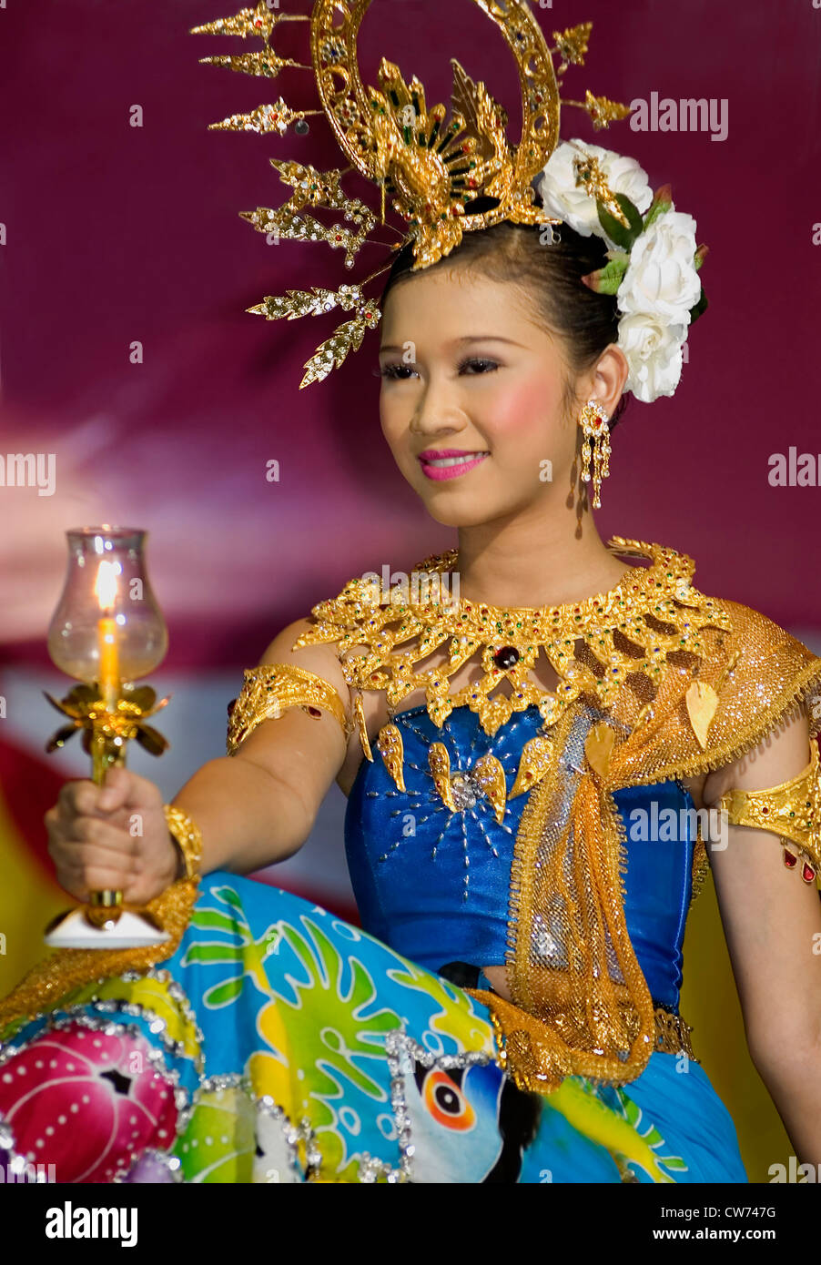 beautiful Thai Lady Dancer in a colourful traditional costume performing at a Beauty Competition during the annual Loy Krathong Festival in Krabi, Thailand Stock Photo