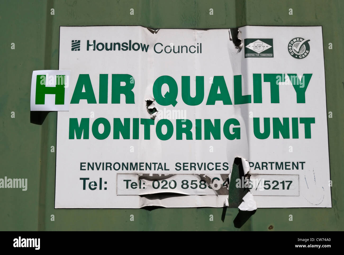 sign in chiswick, london, england, altered to read hair quality rather than air quality monitoring unit Stock Photo