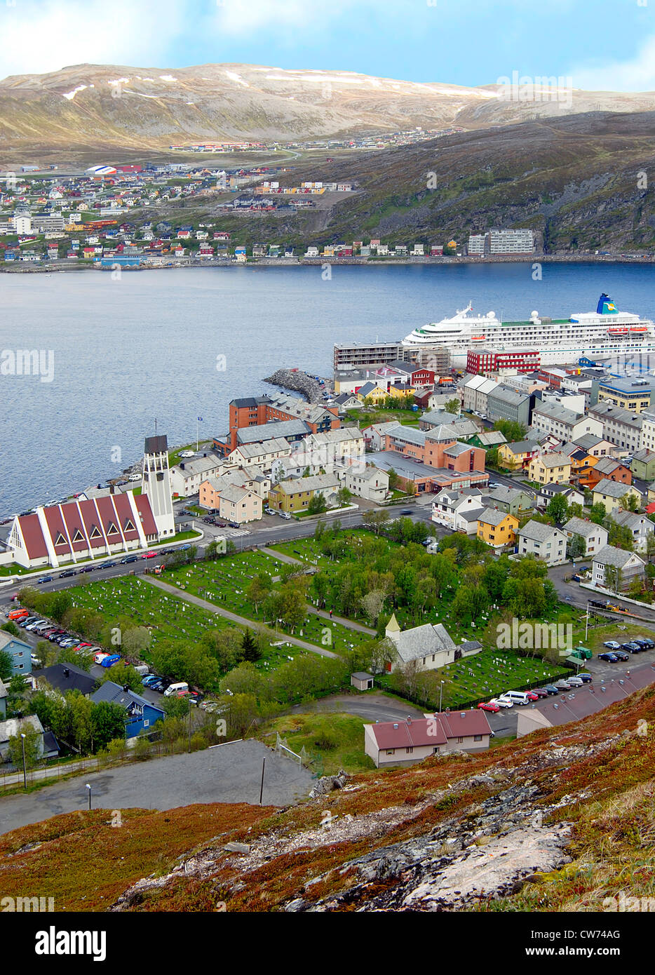 fishing boats and colorful houses in the harbor of Hammerfest in the