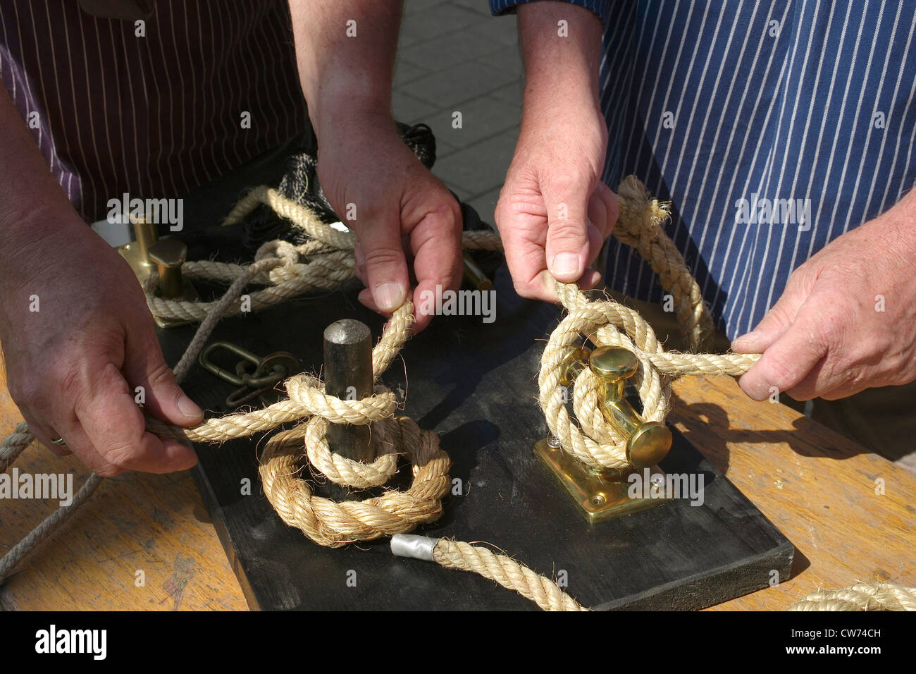 two sailors doing a sailor's knot, Germany, Bremen Stock Photo