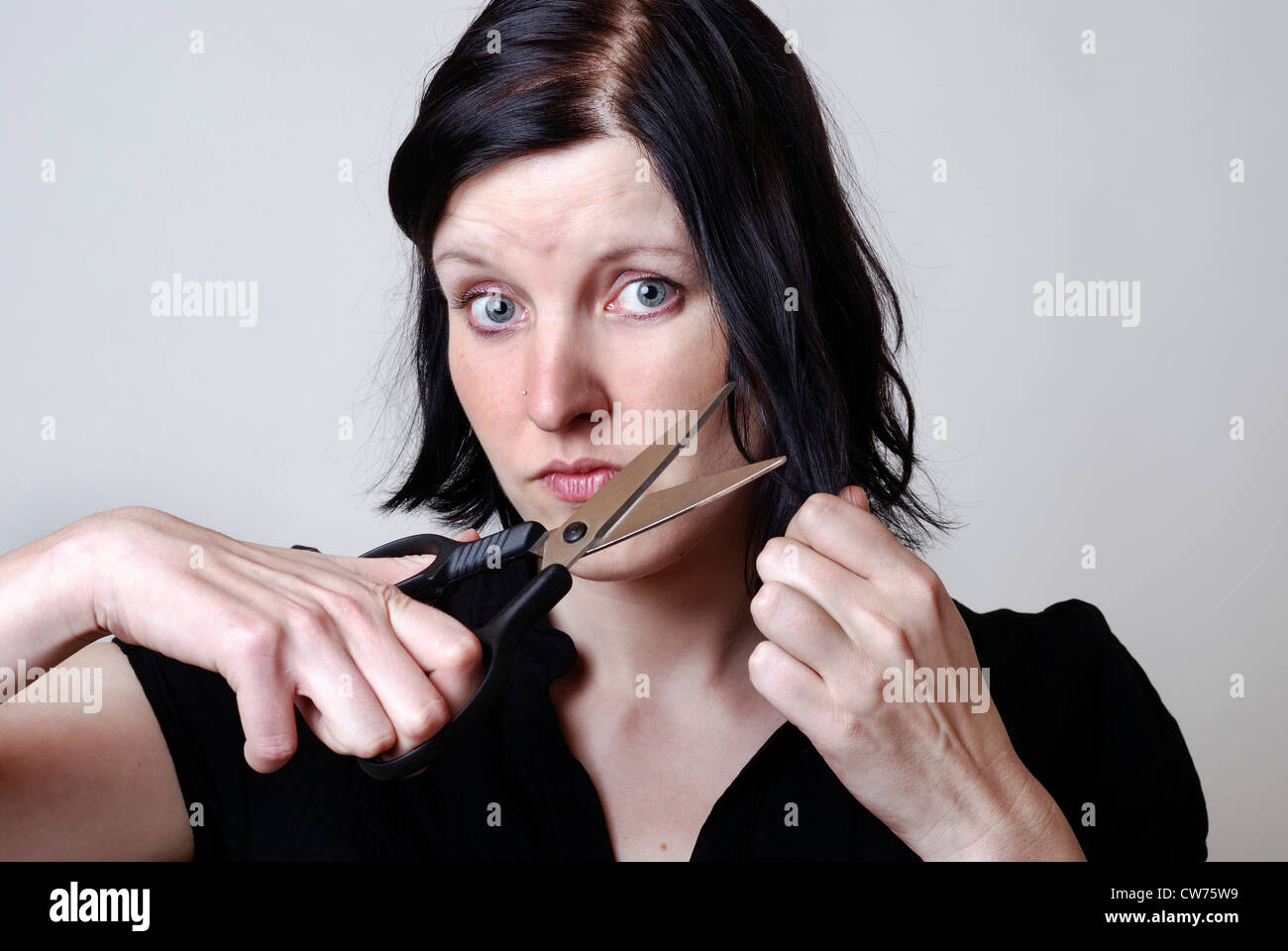 Woman Cuts Her Hair Stock Photo Alamy Woman Cuts Her Hair Stock Photo Alamy
